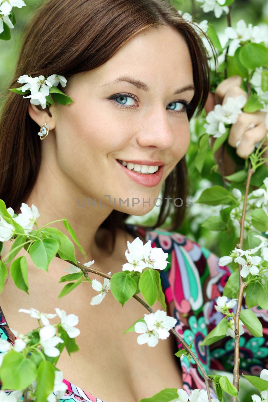Portrait of beautiful woman in spring blossom
