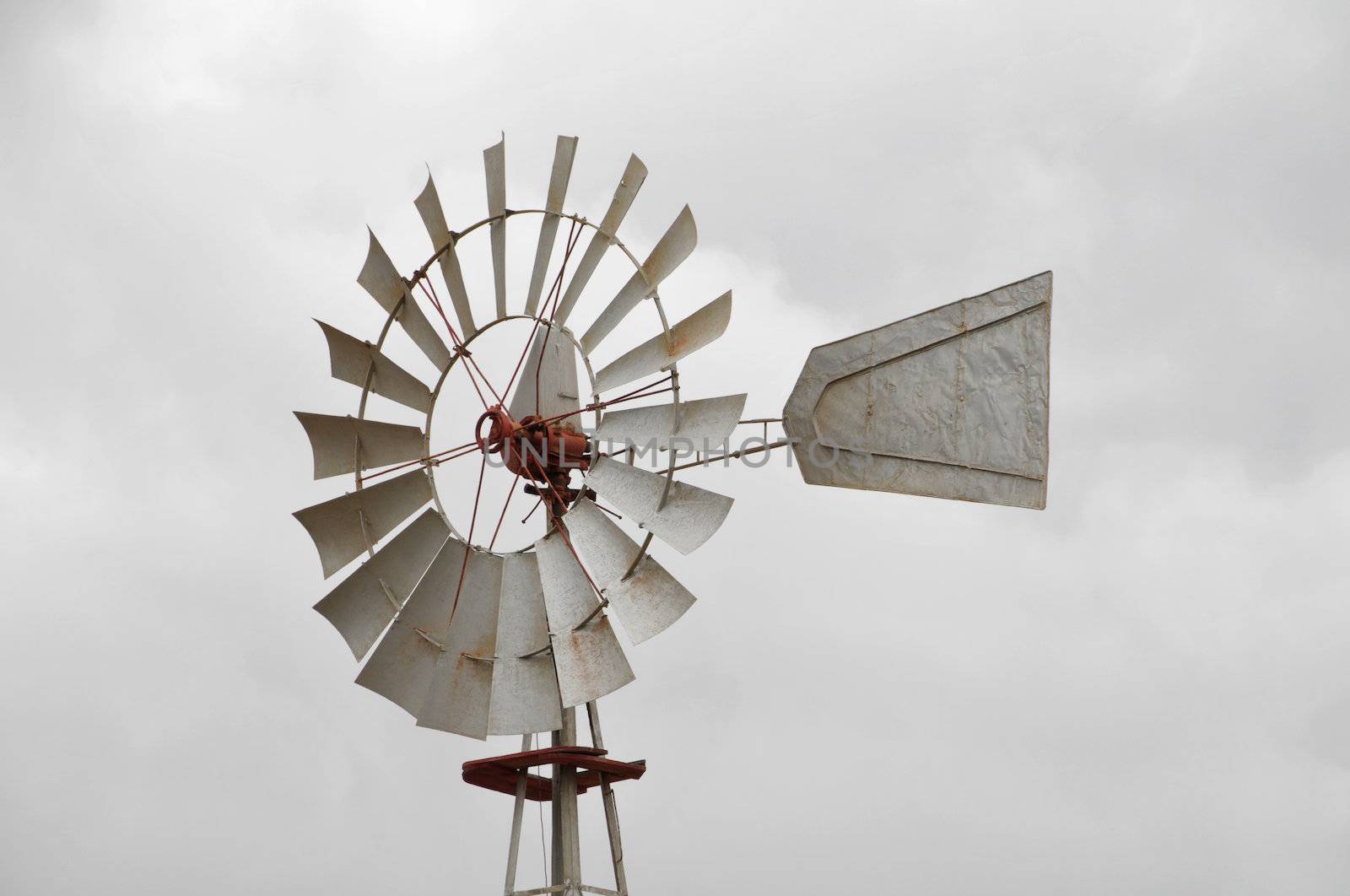 Metal windmill on a cloudy sky, in Canary Islands, Spain
