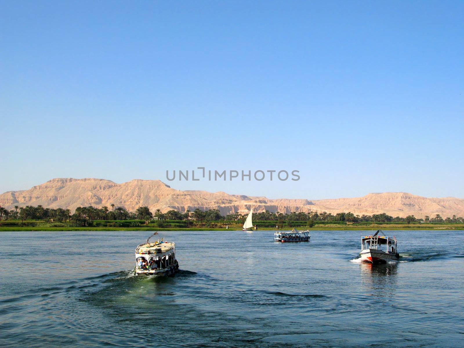 Nile river with boats in Egypt by palinchak