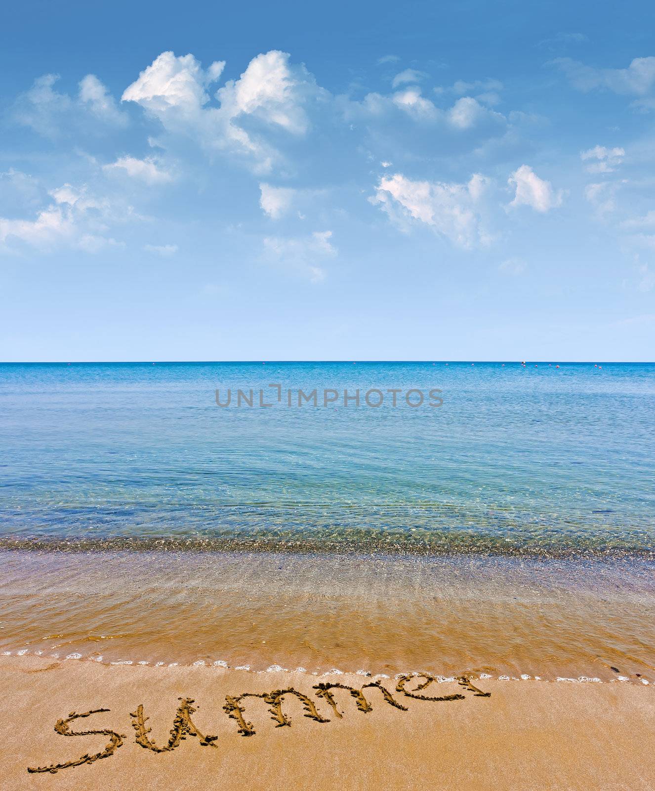 Word summer written on sand 