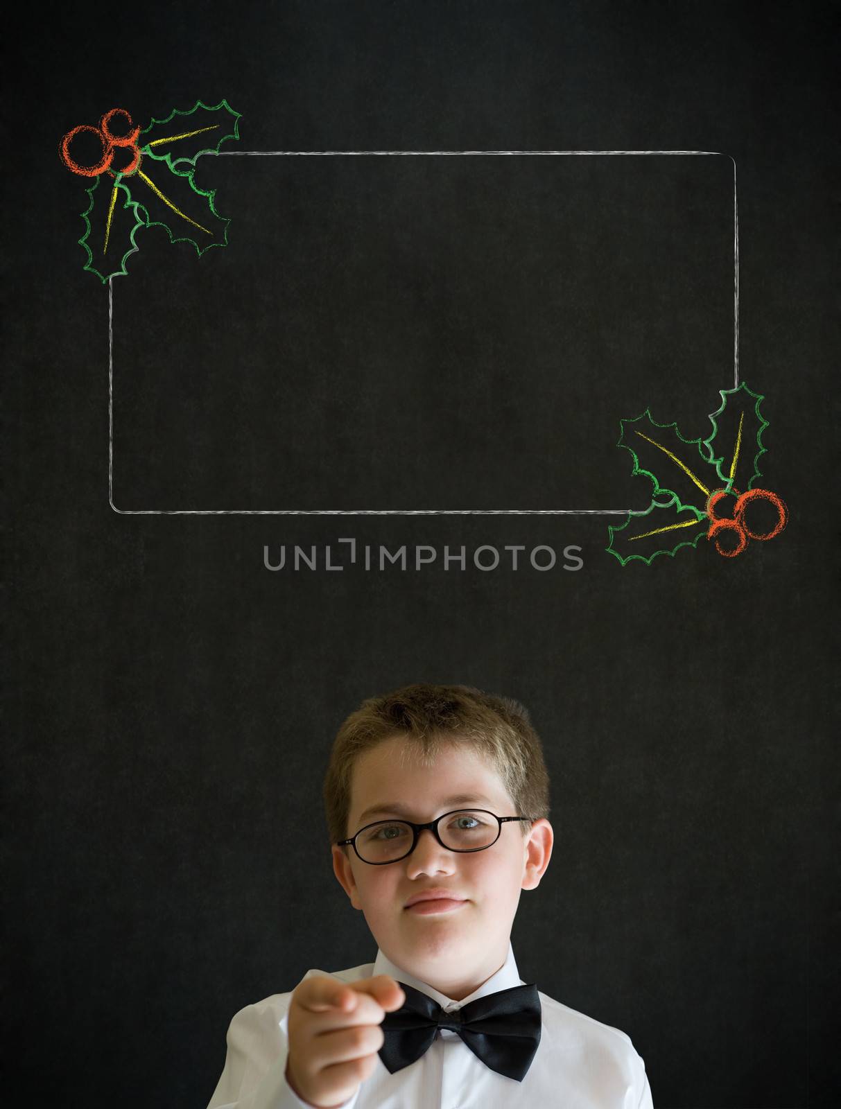 Education needs you thinking boy dressed up as business man with Christmas holly to do checklist on blackboard background