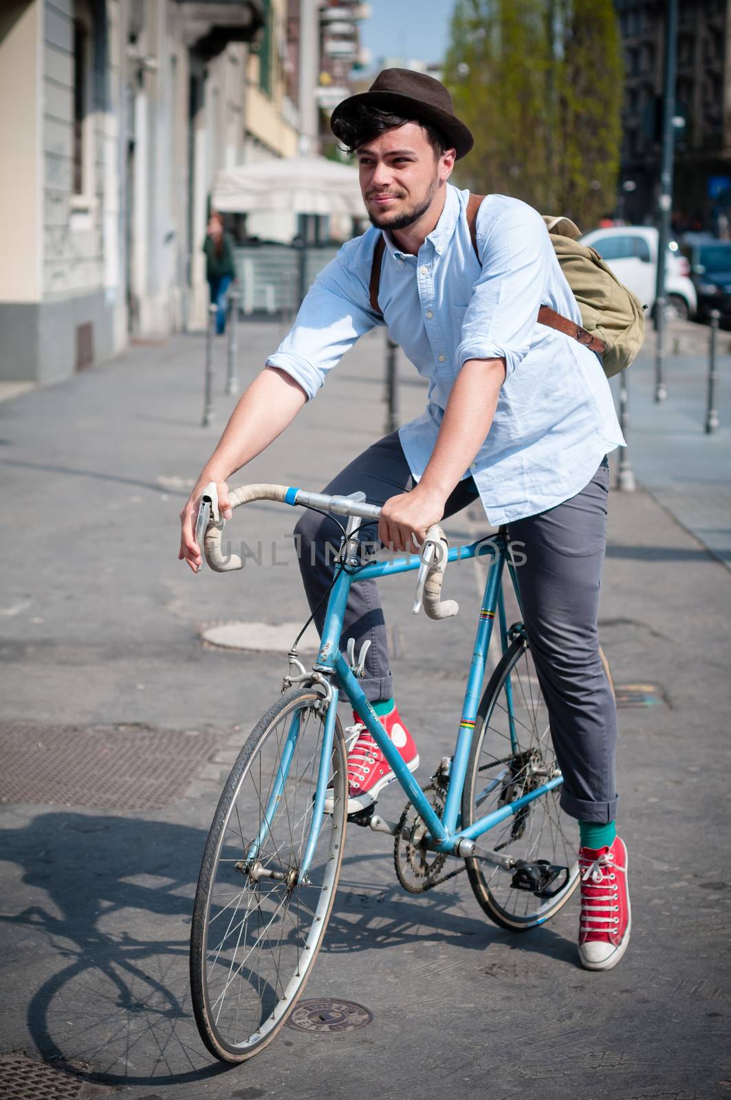 hipster young man on bike in the city