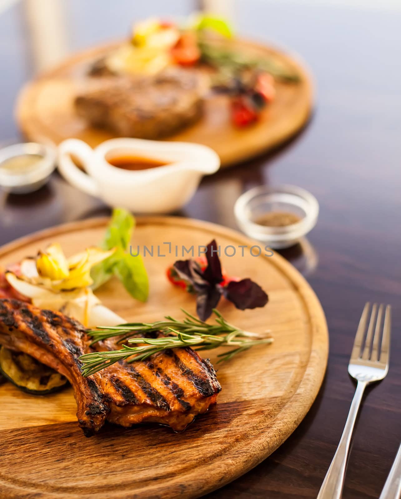 Grilled meat with rosemary, basil and vegetables