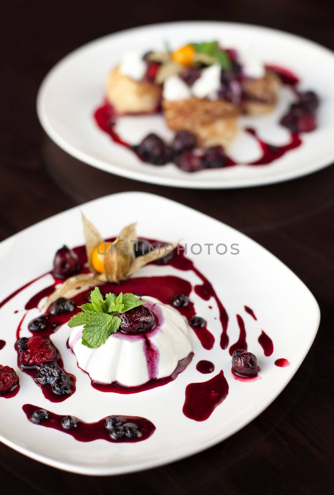 Dessert with berries and mint leaves