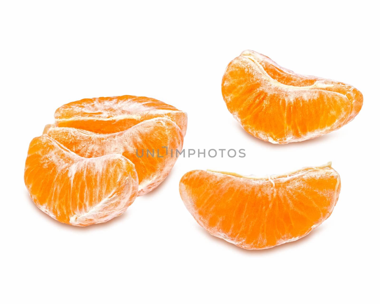 Slices of juicy tangerine isolated on white background