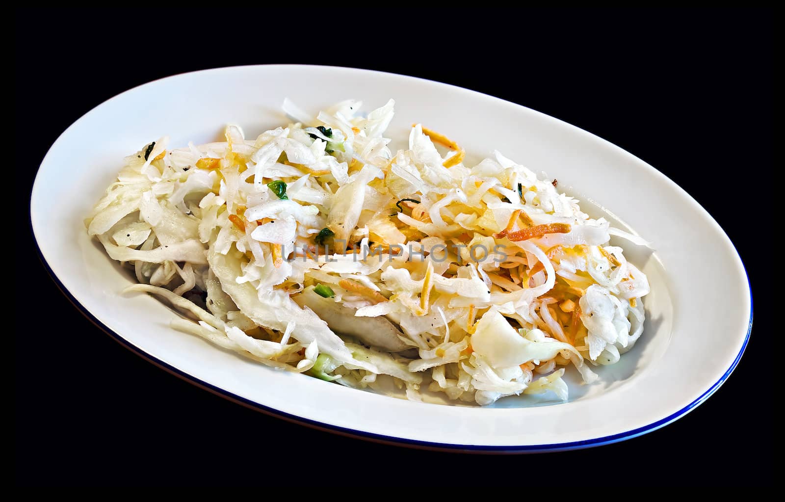 Cabbage salad on a plate isolated on black