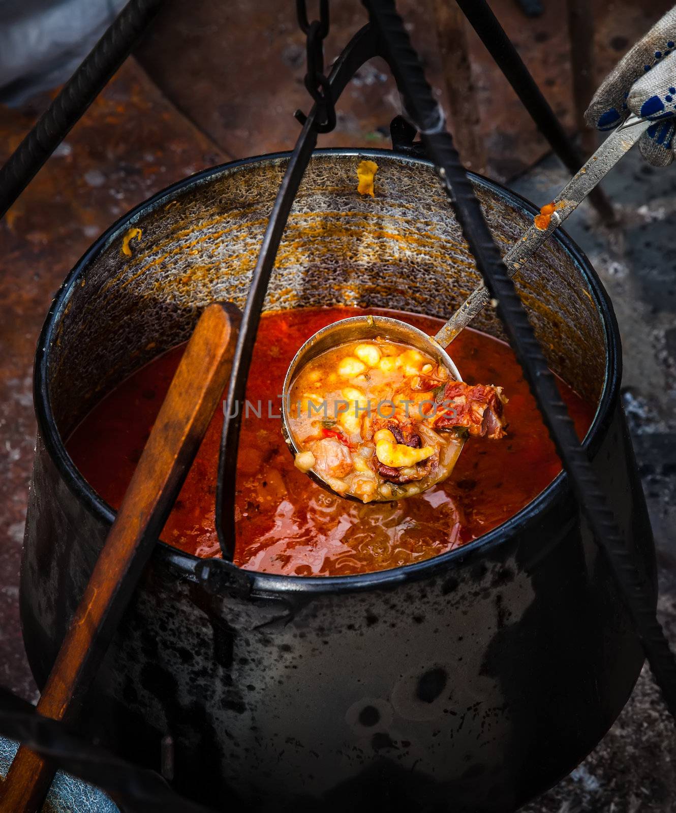 Traditional appetizing and tasty hungarian goulash soup in cauldron