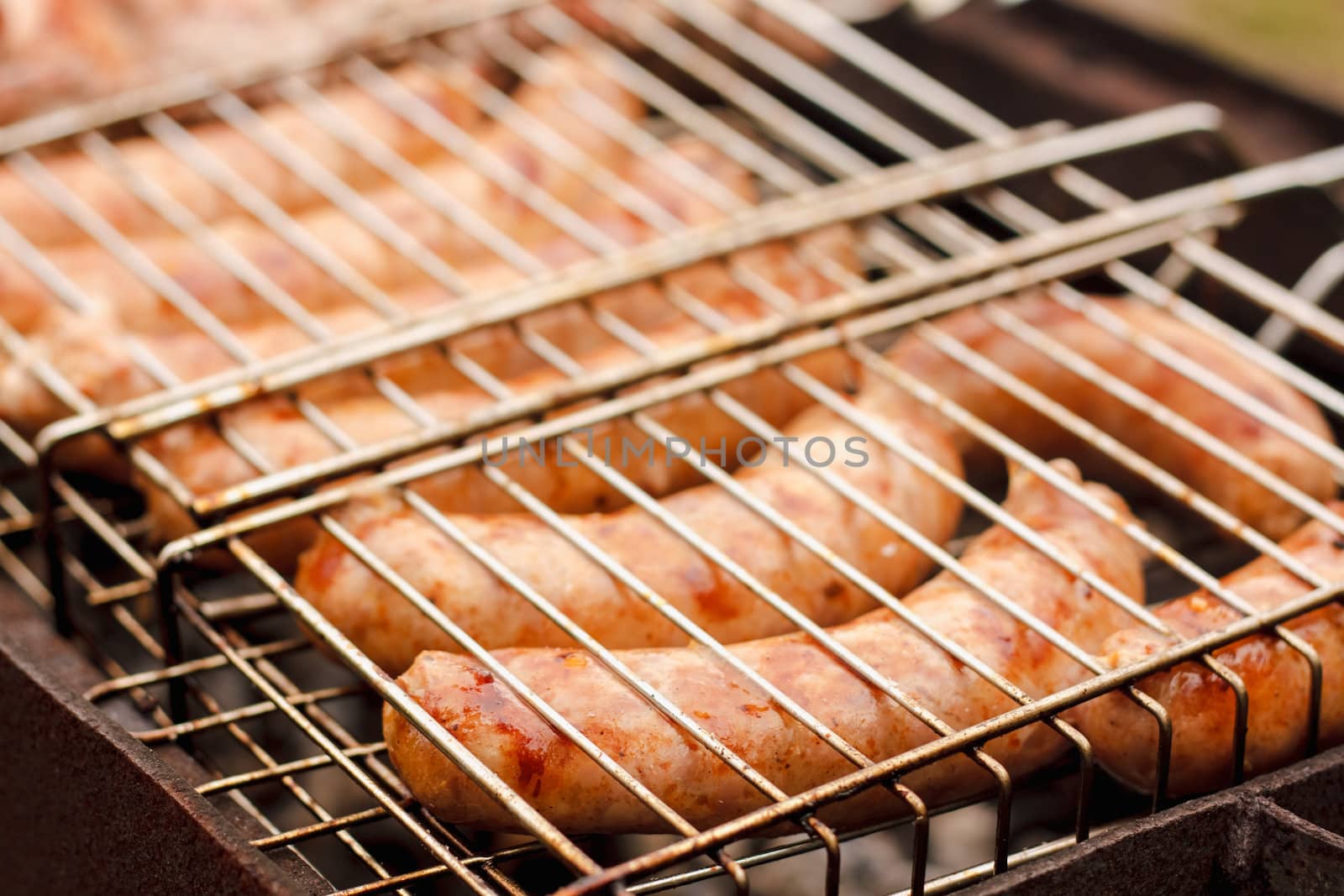 Delicious german sausages on the barbecue grill