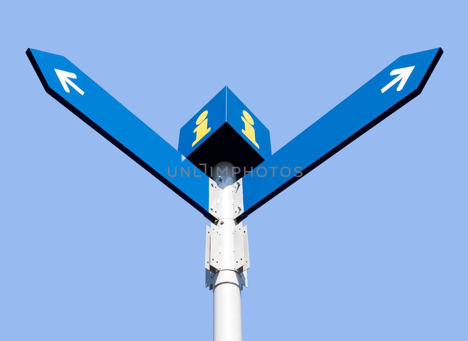Blank directional road signs over blue sky
