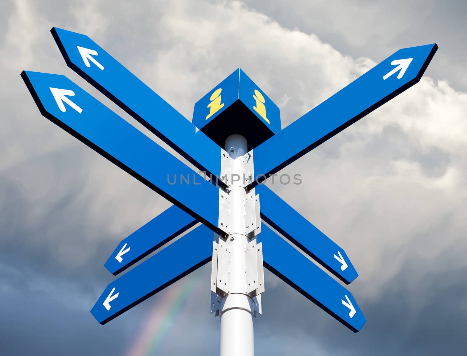 Blank directional road signs on sky background