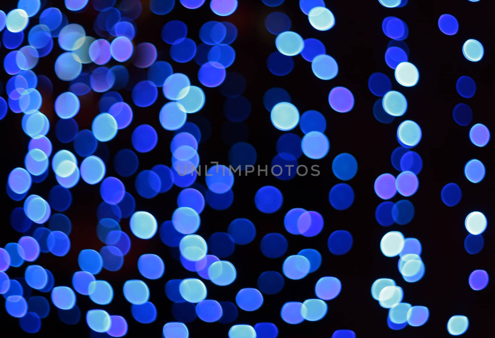 Defocus (bokeh) of blue spots lights background