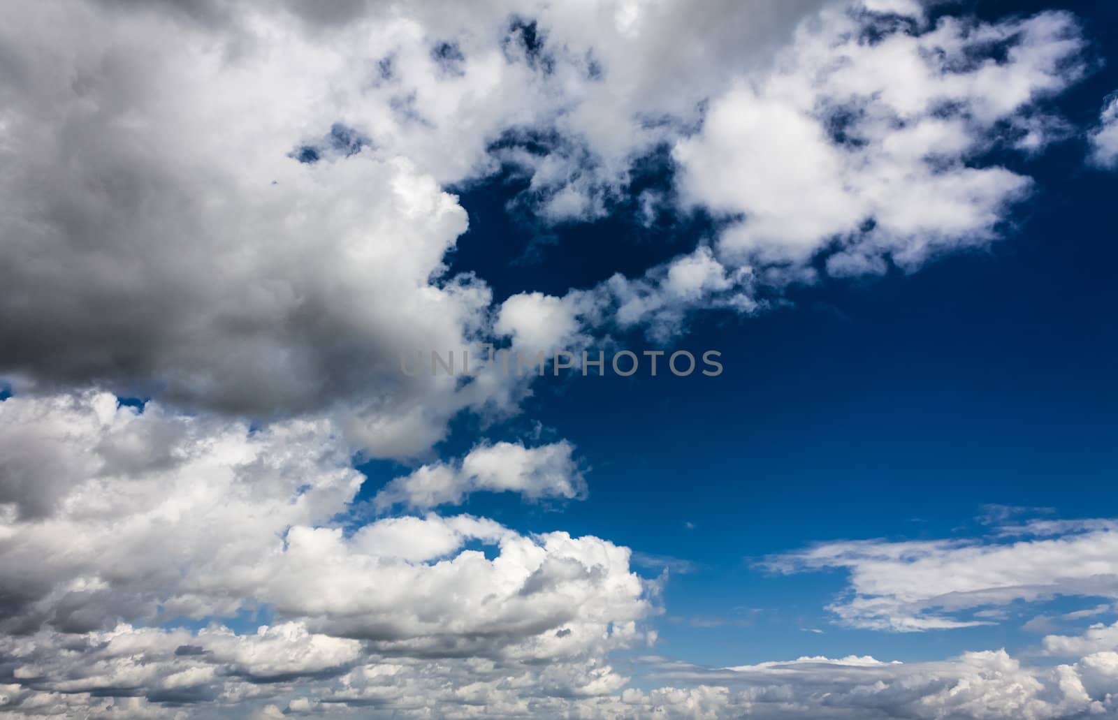 White Fluffy Clouds In The Blue Sky