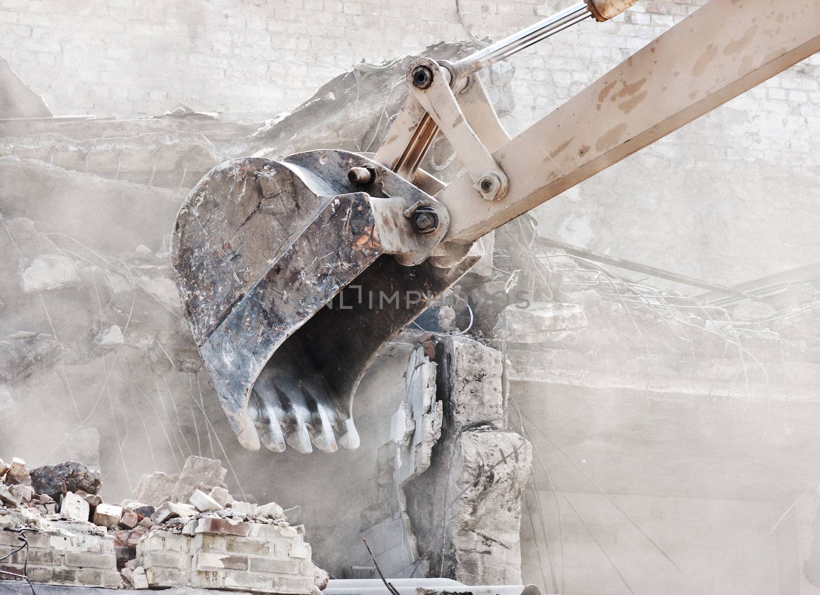 Excavator demolishing  of an old building