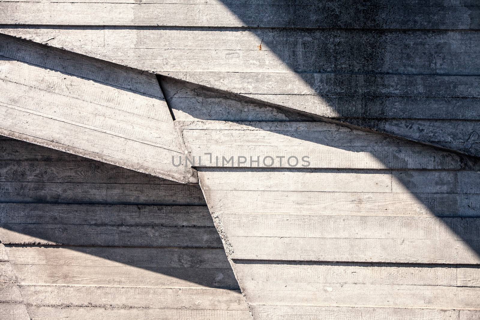 Abstract geometric concrete background  illuminated by sun