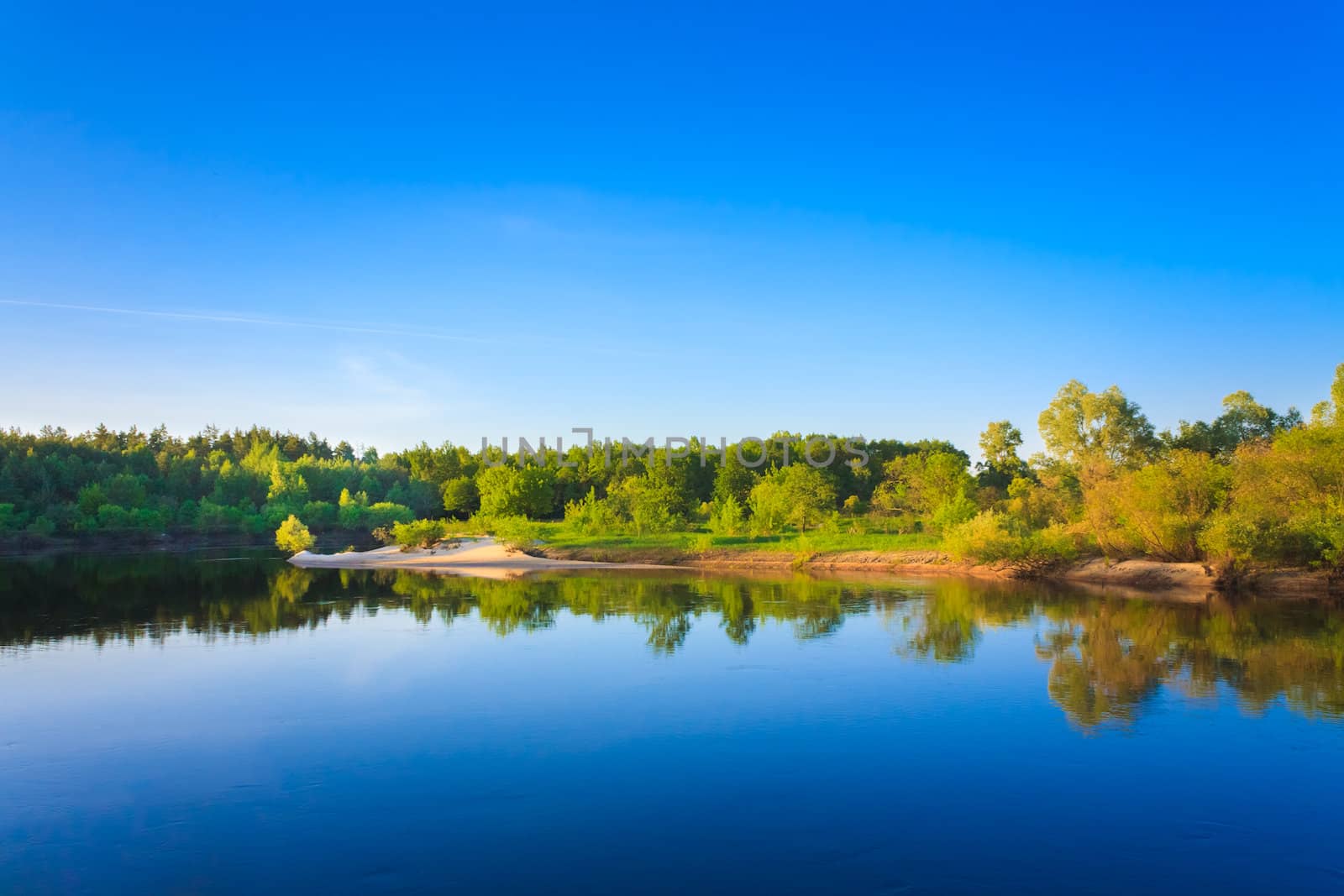 Summer Landscape With River And Blue Sky.