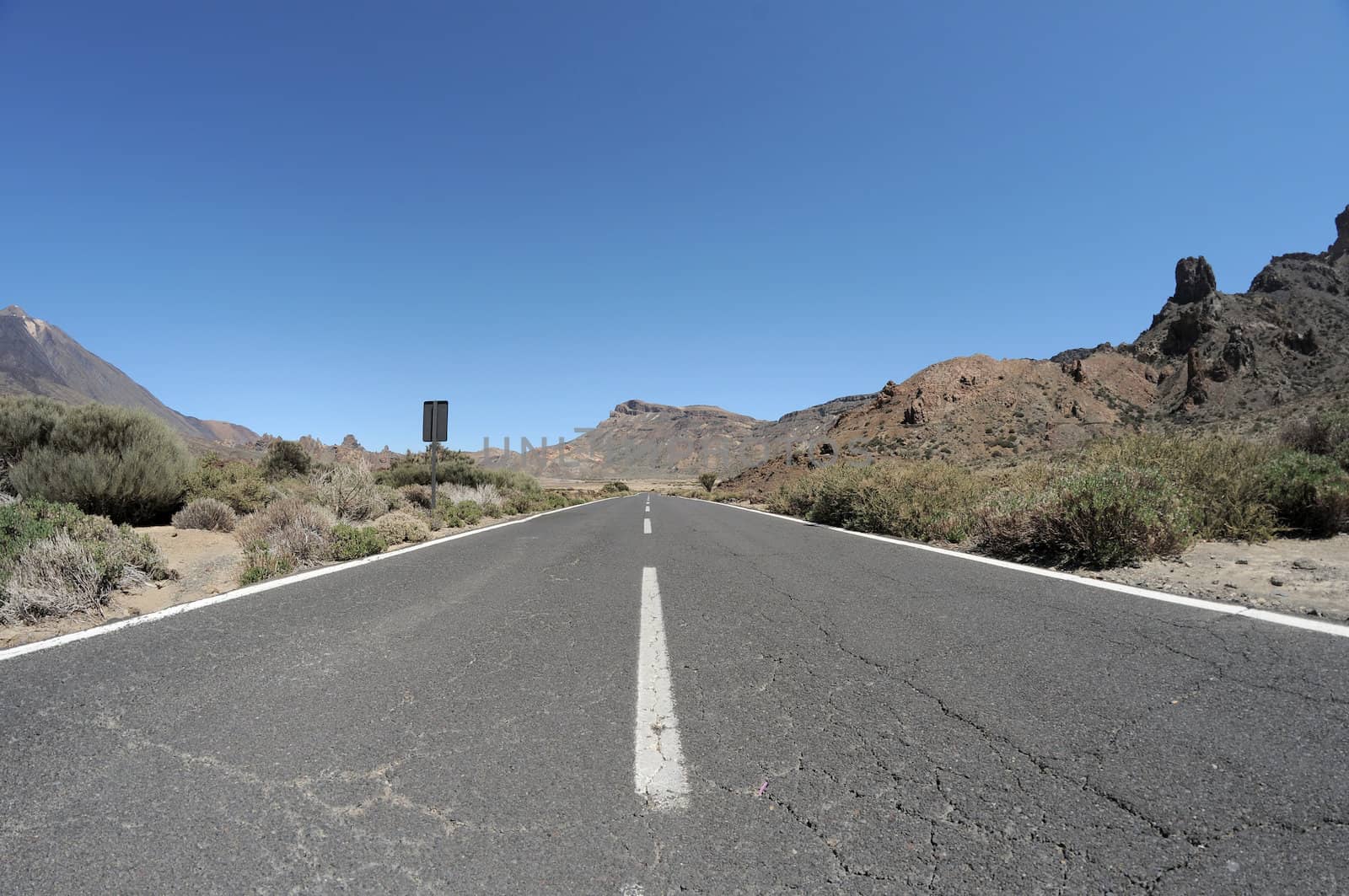 Empty road in the desert to infinity,in Tenerife, Spain