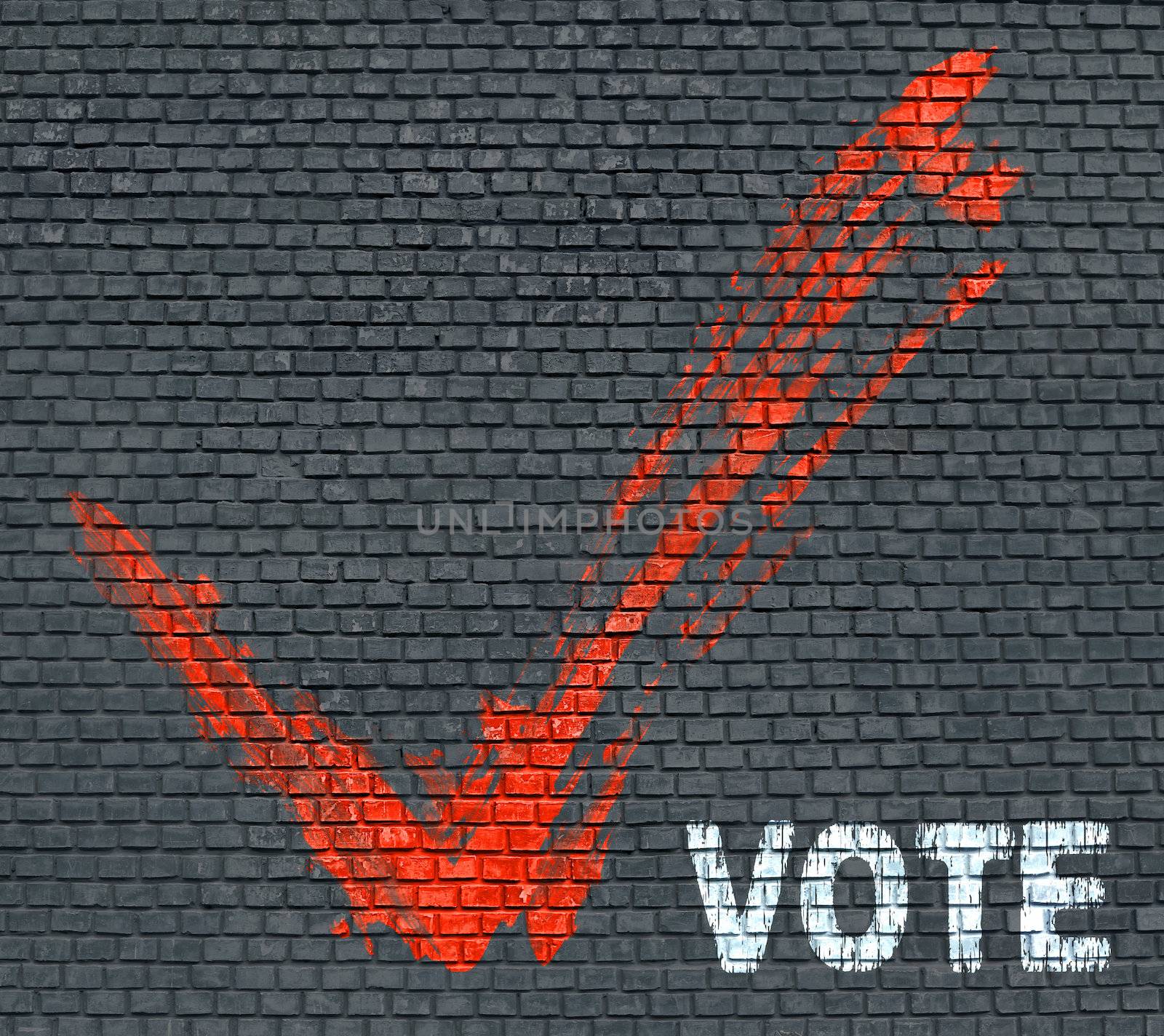 Red painted tick and word Vote on blue brick wall background