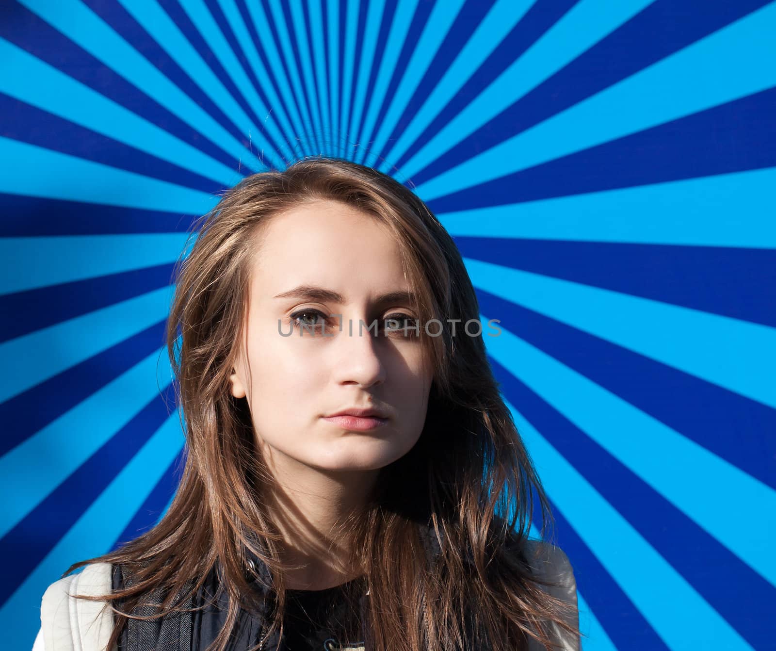 Young woman portrait on a striped background