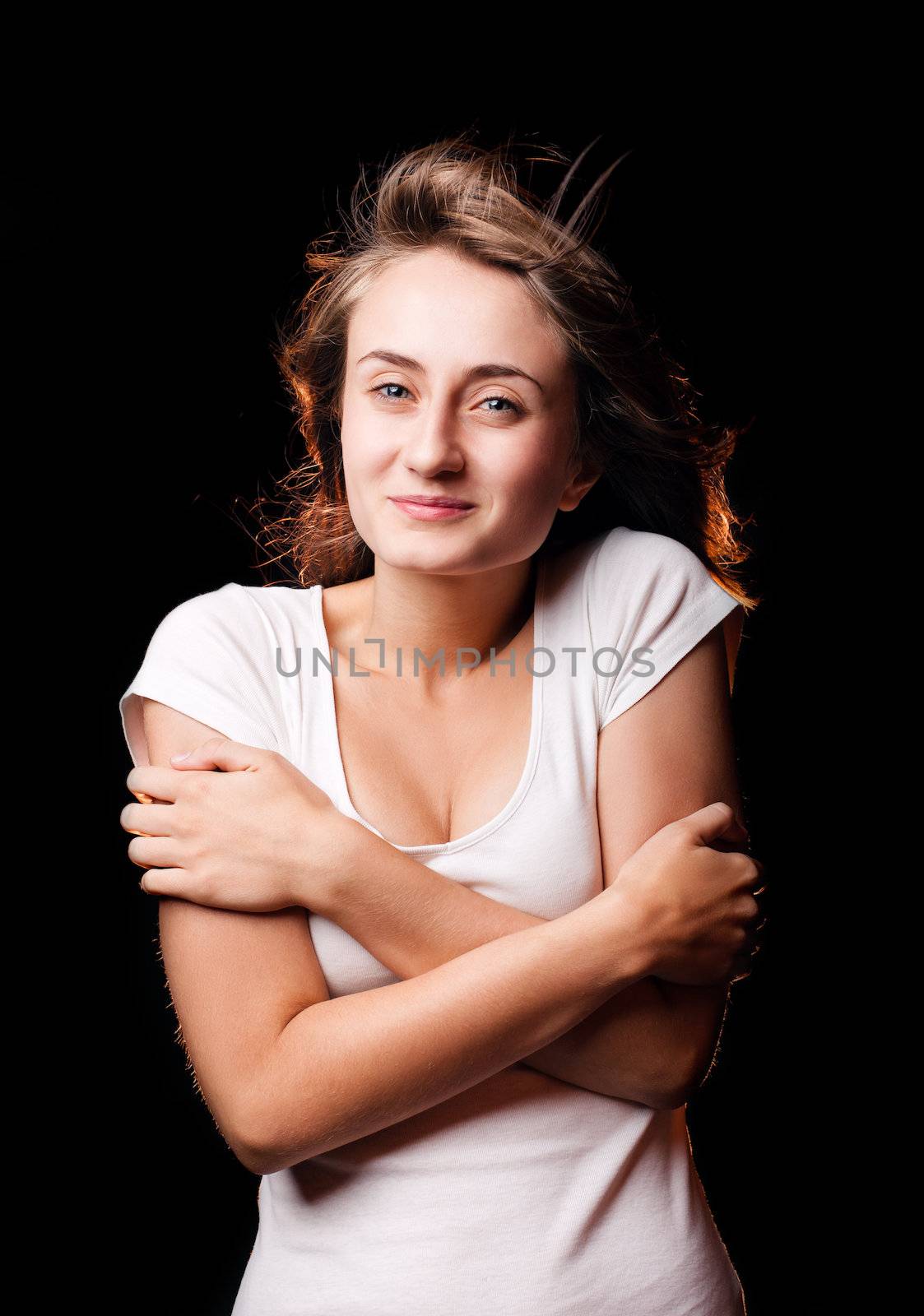 Beautiful woman studio portrait with cold wind on hair