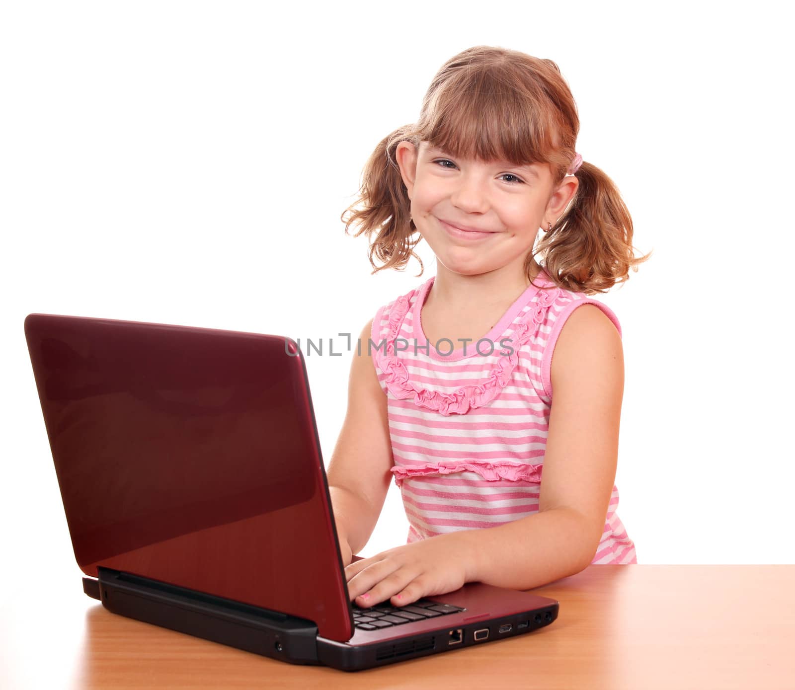 happy little girl with laptop by goce