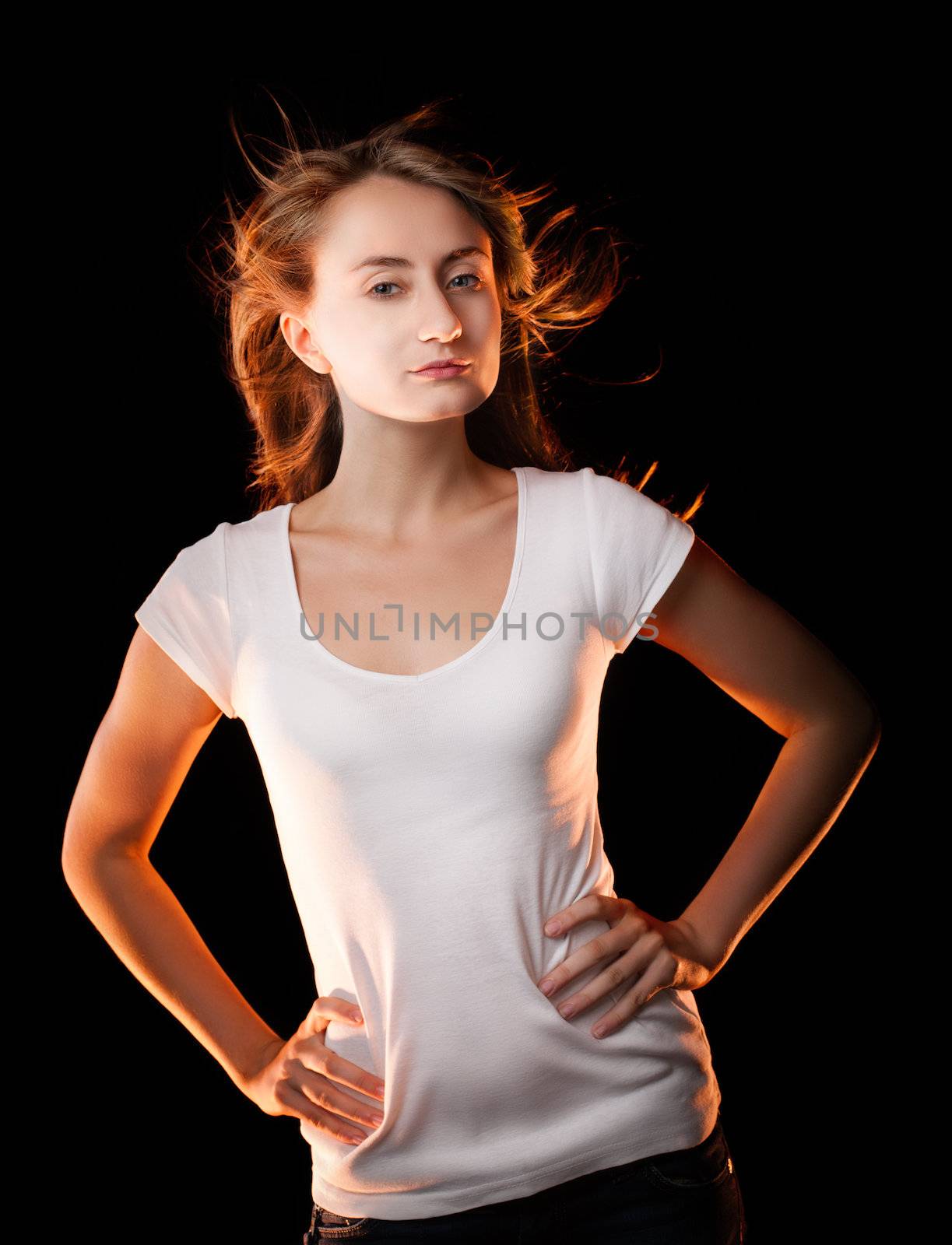 Portrait of a beautiful young woman on a dark background