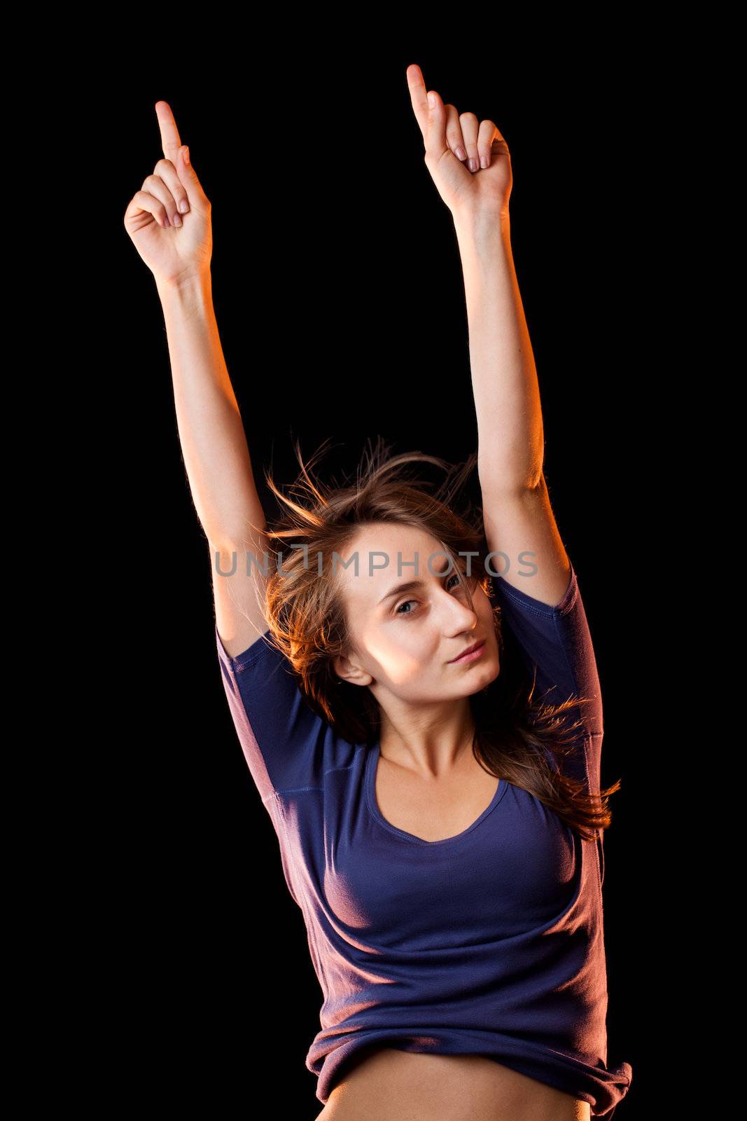 Portrait of a beautiful young woman on a dark background