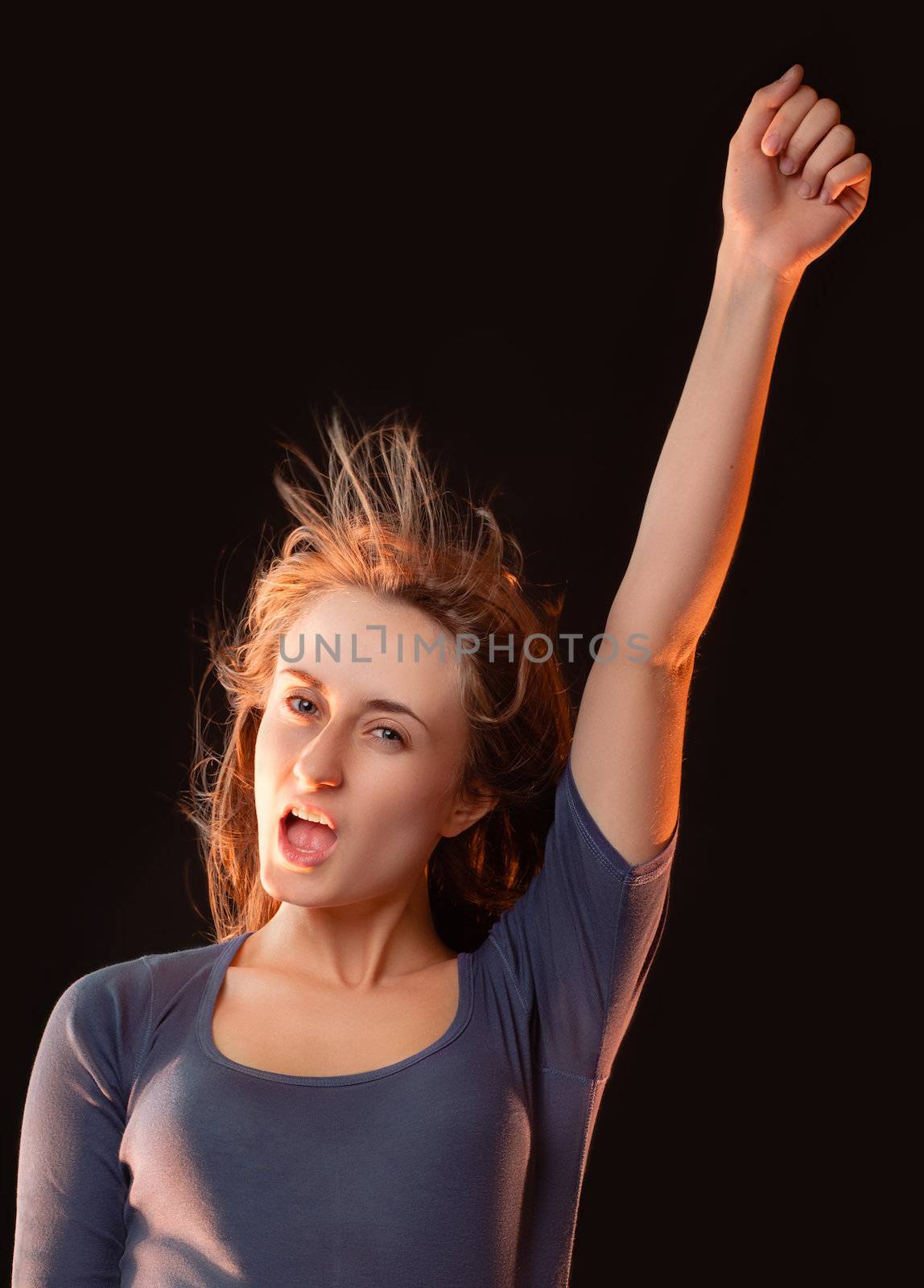 Portrait of emotional girl with her hand raised