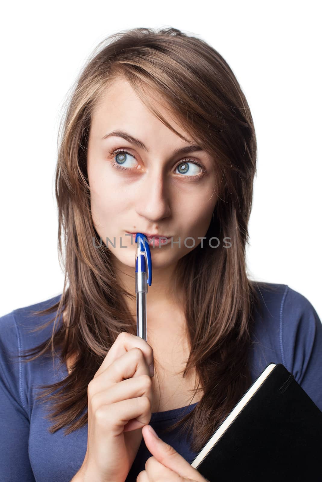 student with a pen and a notebook on a white background