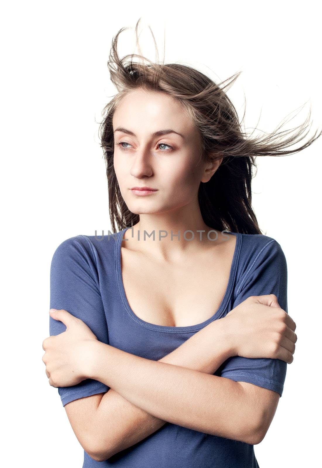 Portrait of a beautiful young woman with hair flying