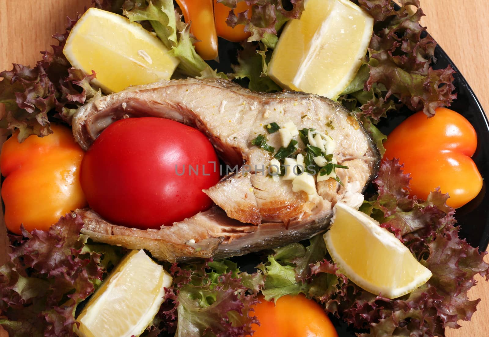seafood salmon with tomato lemon and salad