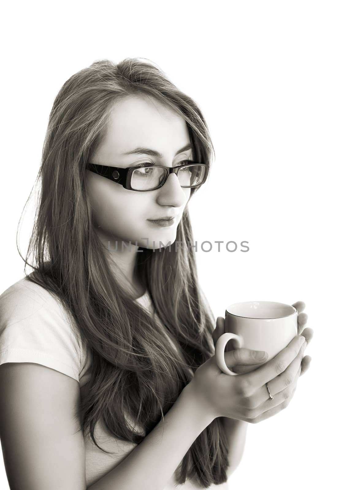 Beatiful young woman in glasses with cup of tea on white background