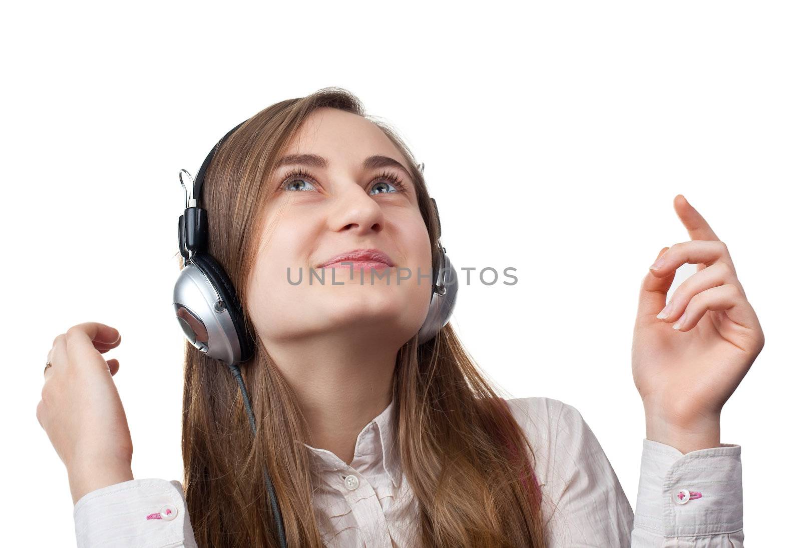 Girl listening to music in headphones
 isolated on white background