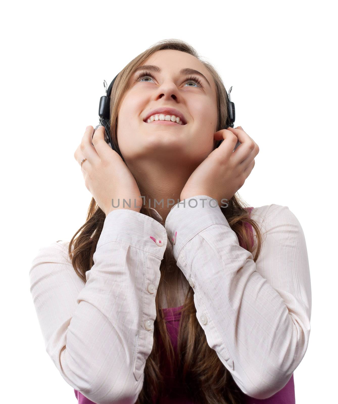 Girl listening to music in headphones
 isolated on white background