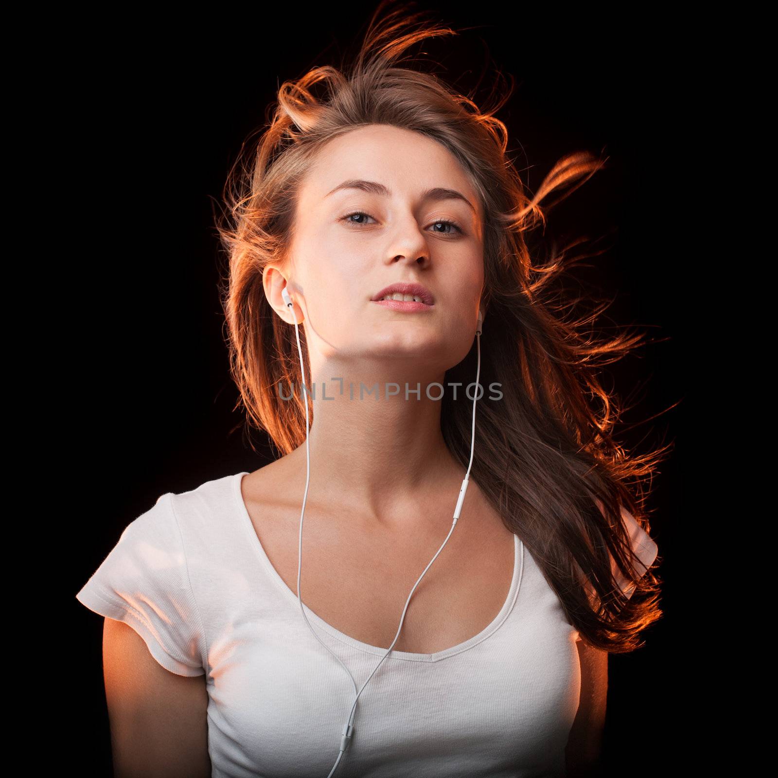 Beautiful Woman Listening Music  on a dark background