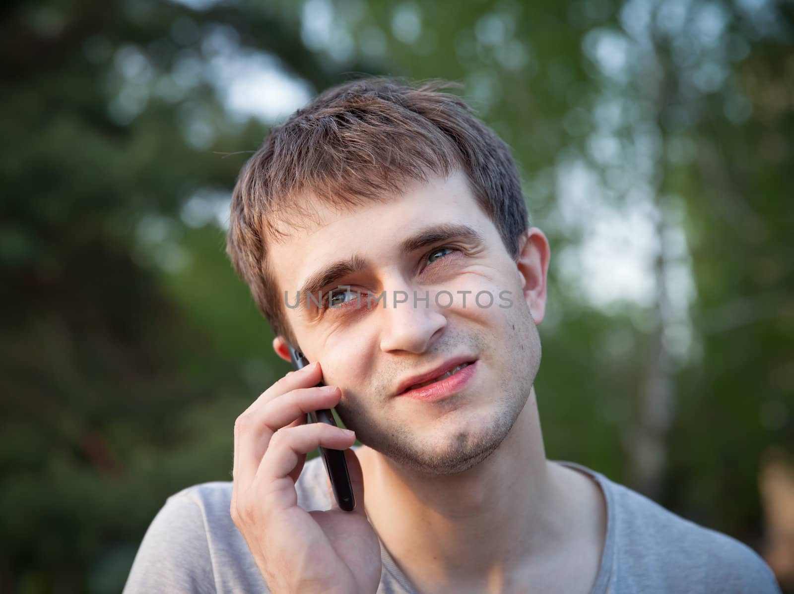 man phoning in the park by palinchak