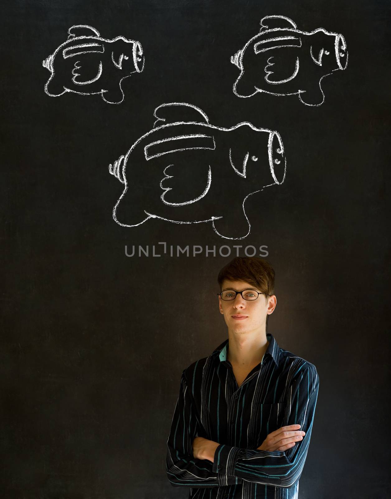 Businessman, student or teacher with chalk piggy banks concept by alistaircotton