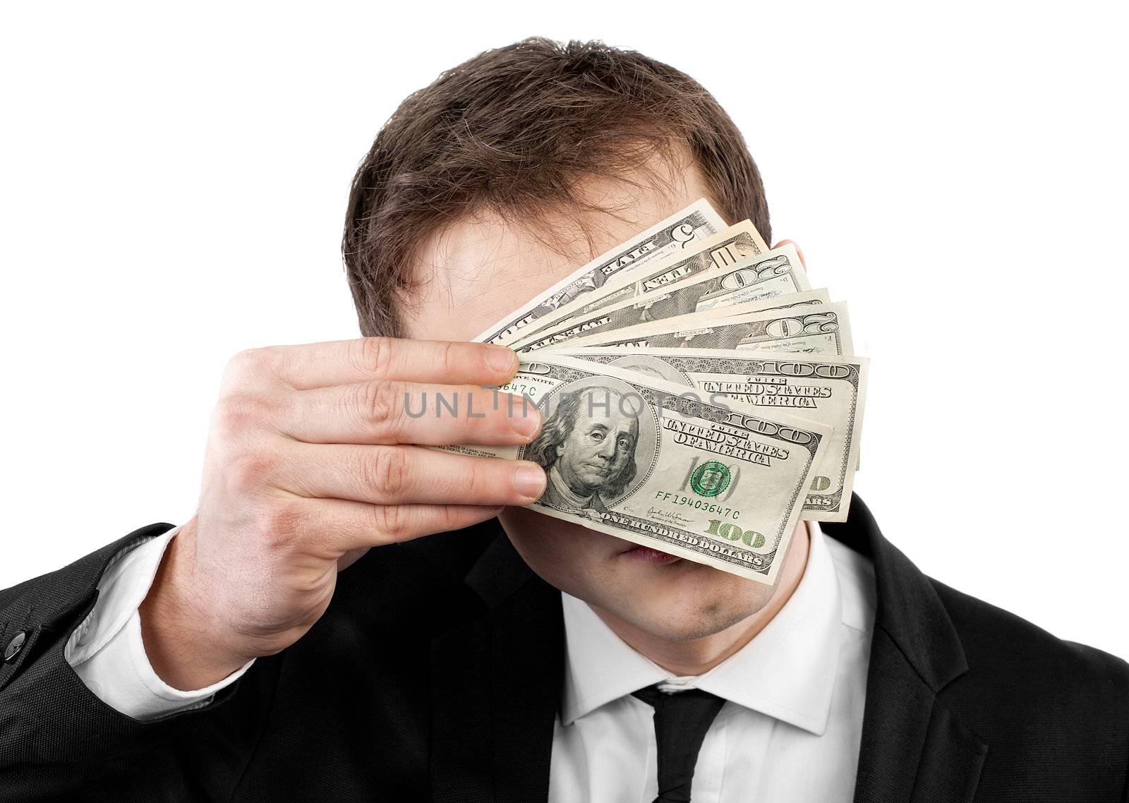 Businessman holding money with face behind dollars