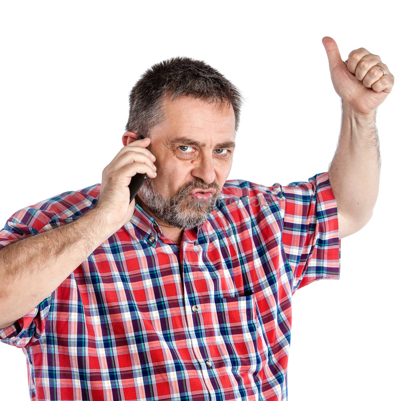 Middle-aged man speaks on a mobile phone and  raised thumb up showing sign ok. Isolated on white