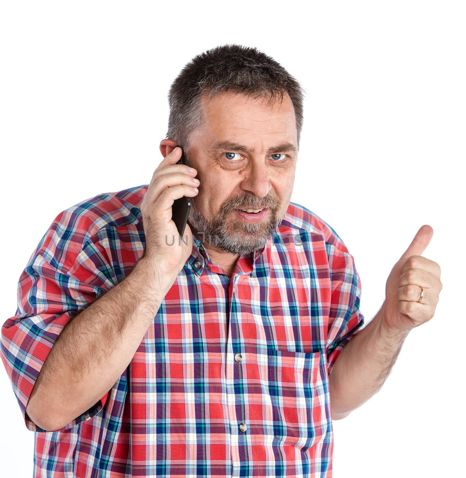 Middle-aged man speaks on a mobile phone and  raised thumb up showing sign ok. Isolated on white