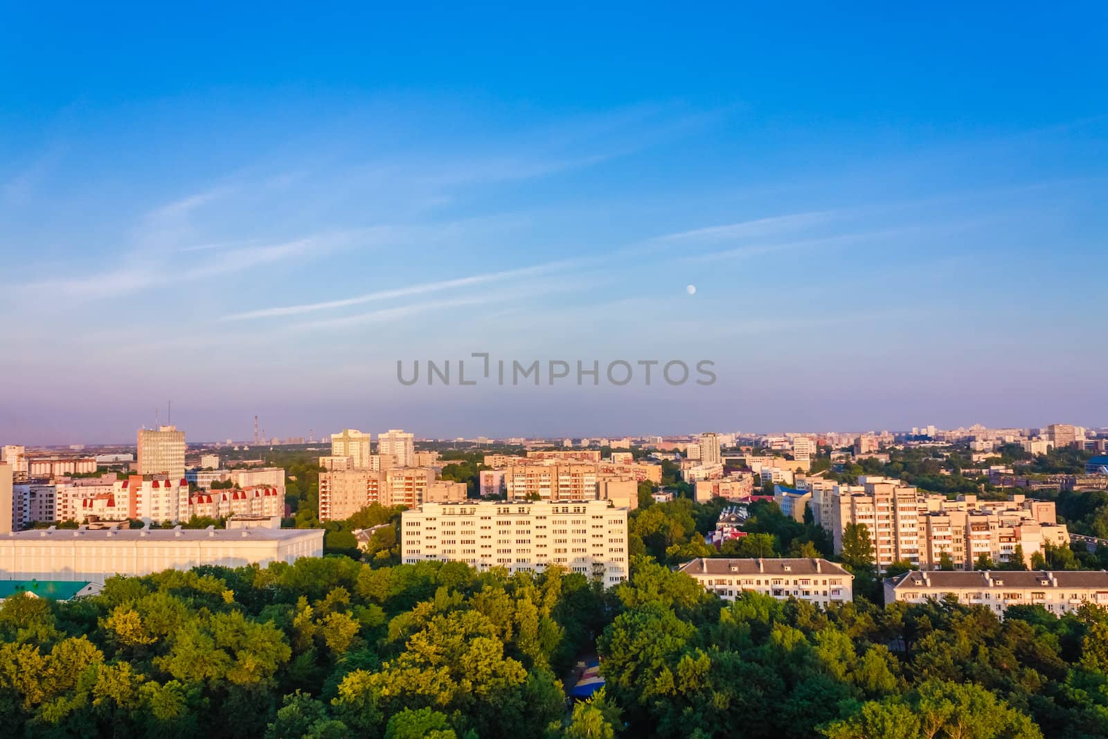 Buildings In A City In An Environment Of Green Trees