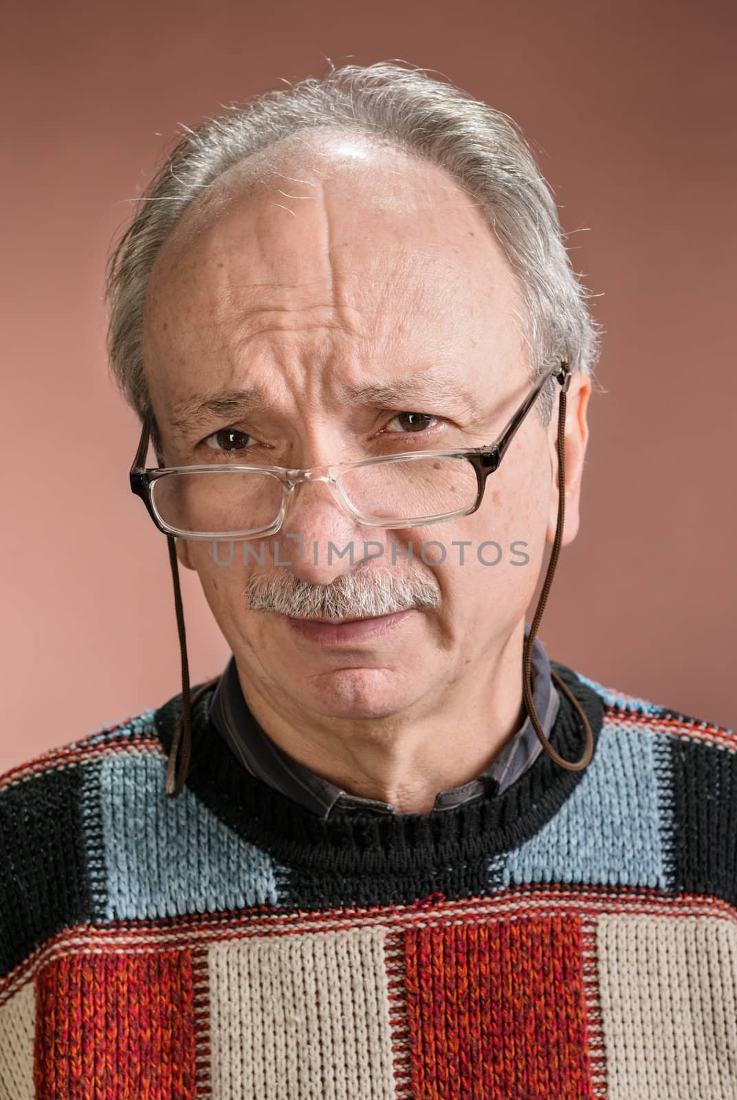 Portarit  of senior man with glasses