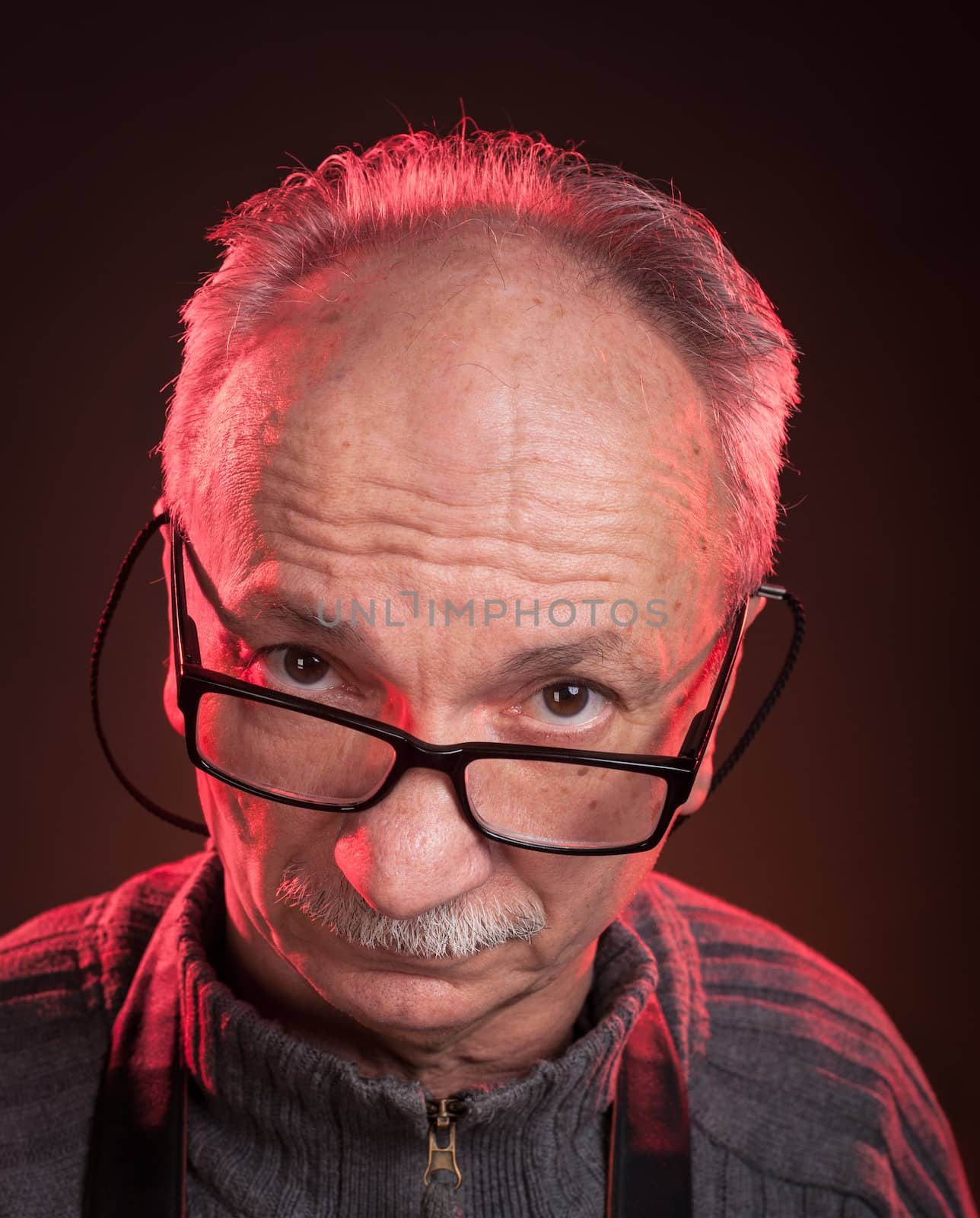 Portrait of handsome senior man with glasses
