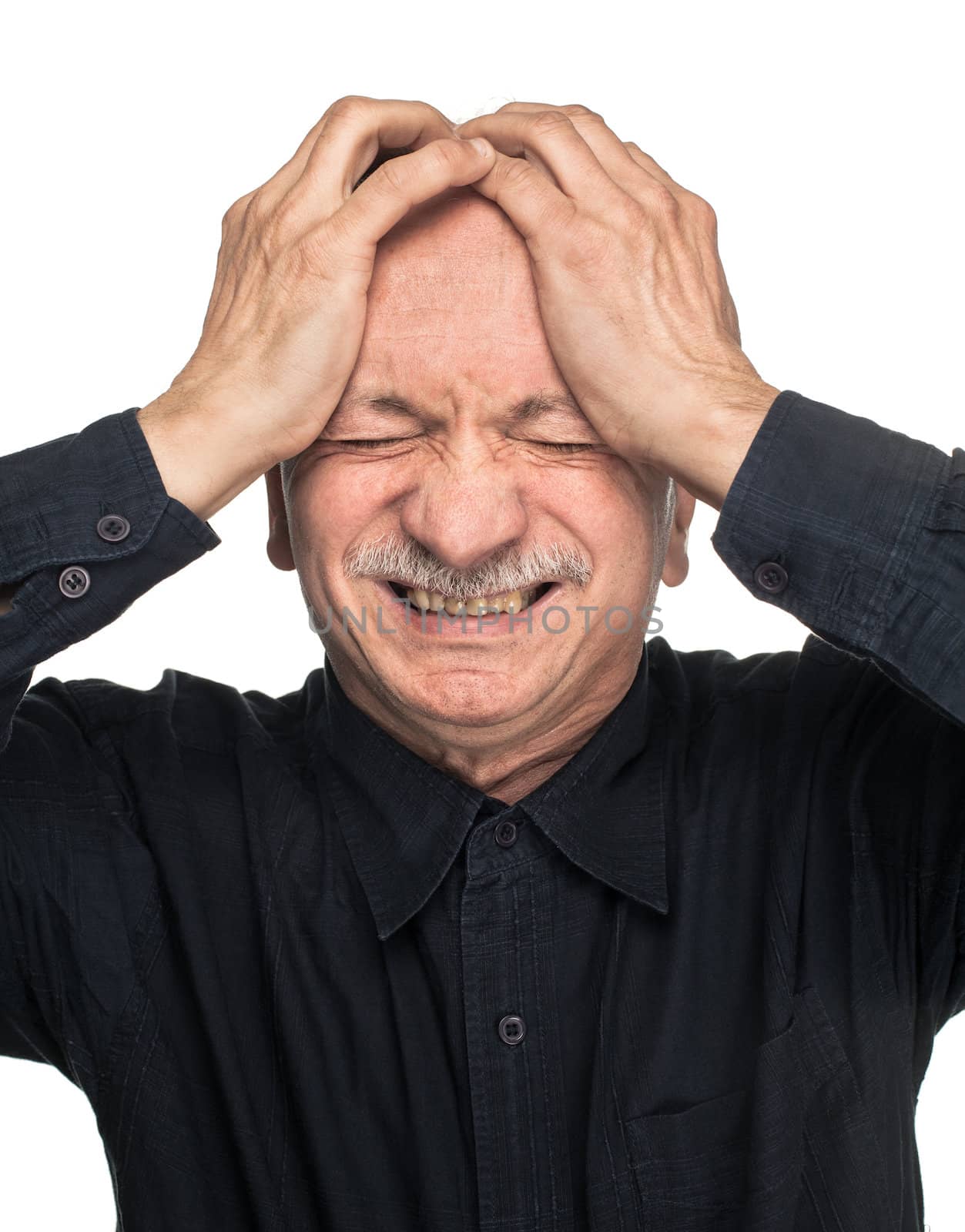 Pain. Elderly man suffering from a headache isolated on white