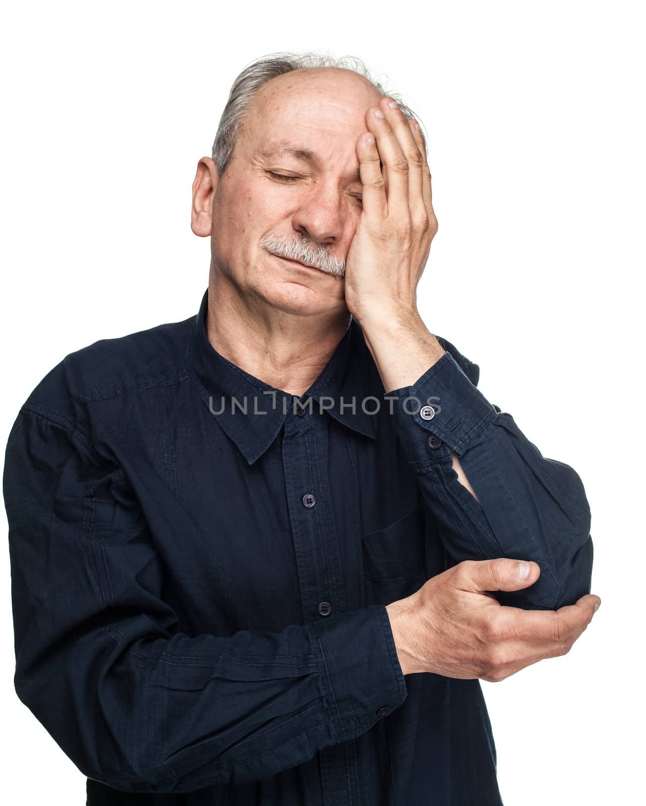 Elderly man suffering from a headache isolated on white