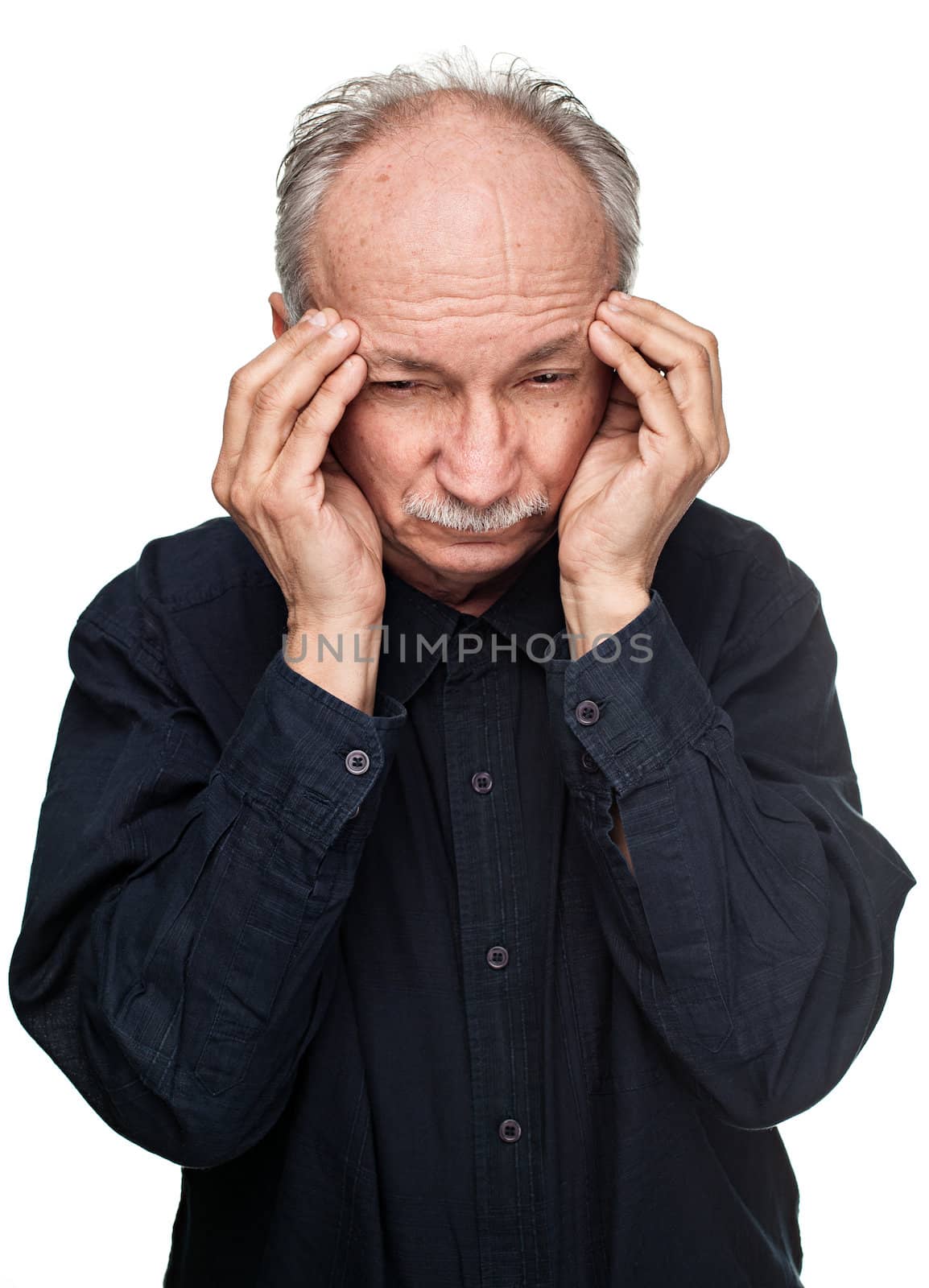 Old man suffering from a headache isolated on white