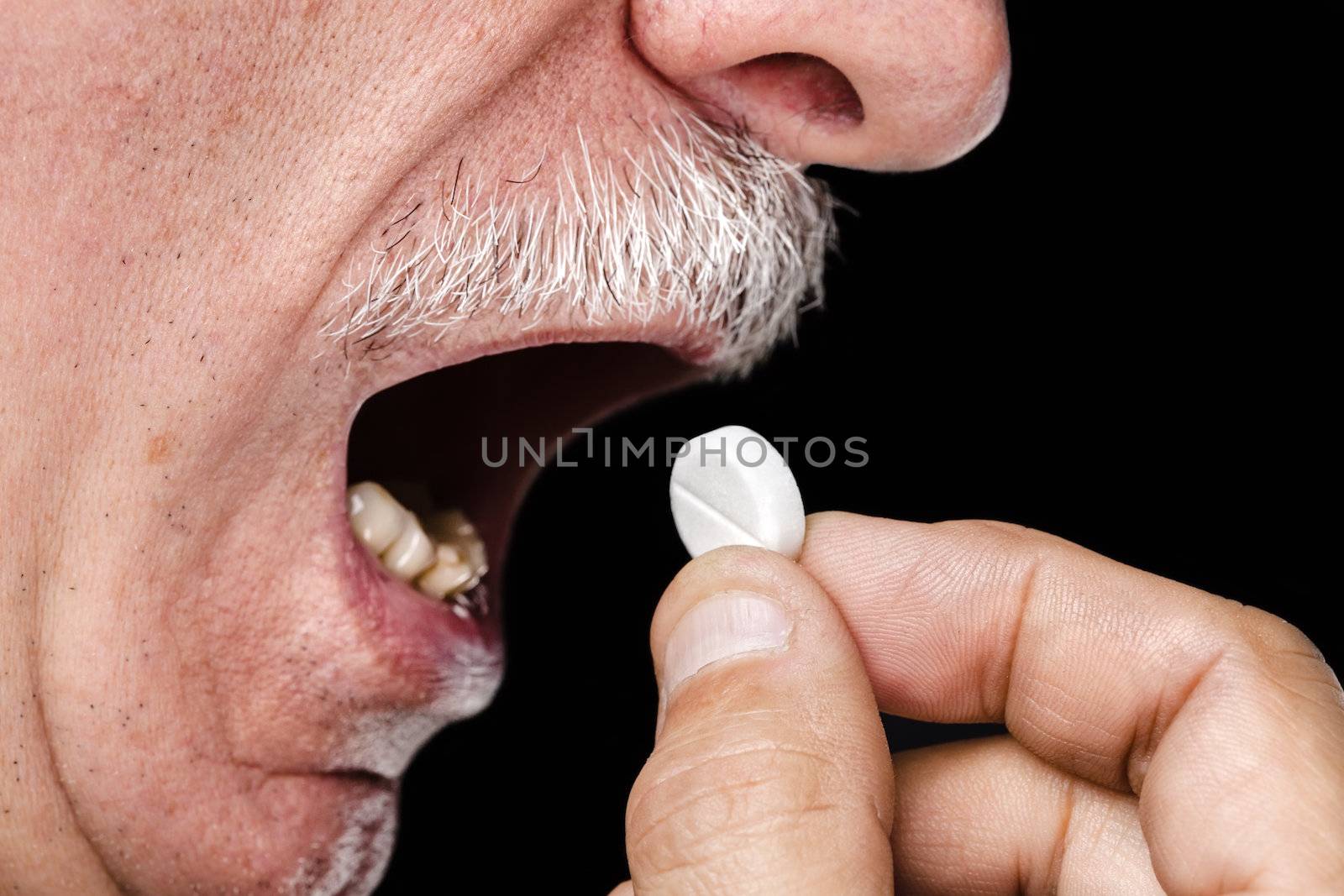 Old man wants to take a pill