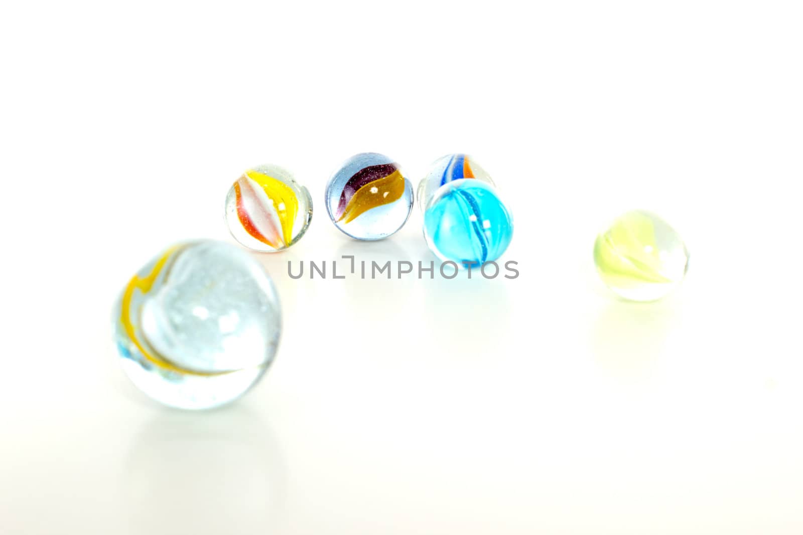 Colourful marbles on white background