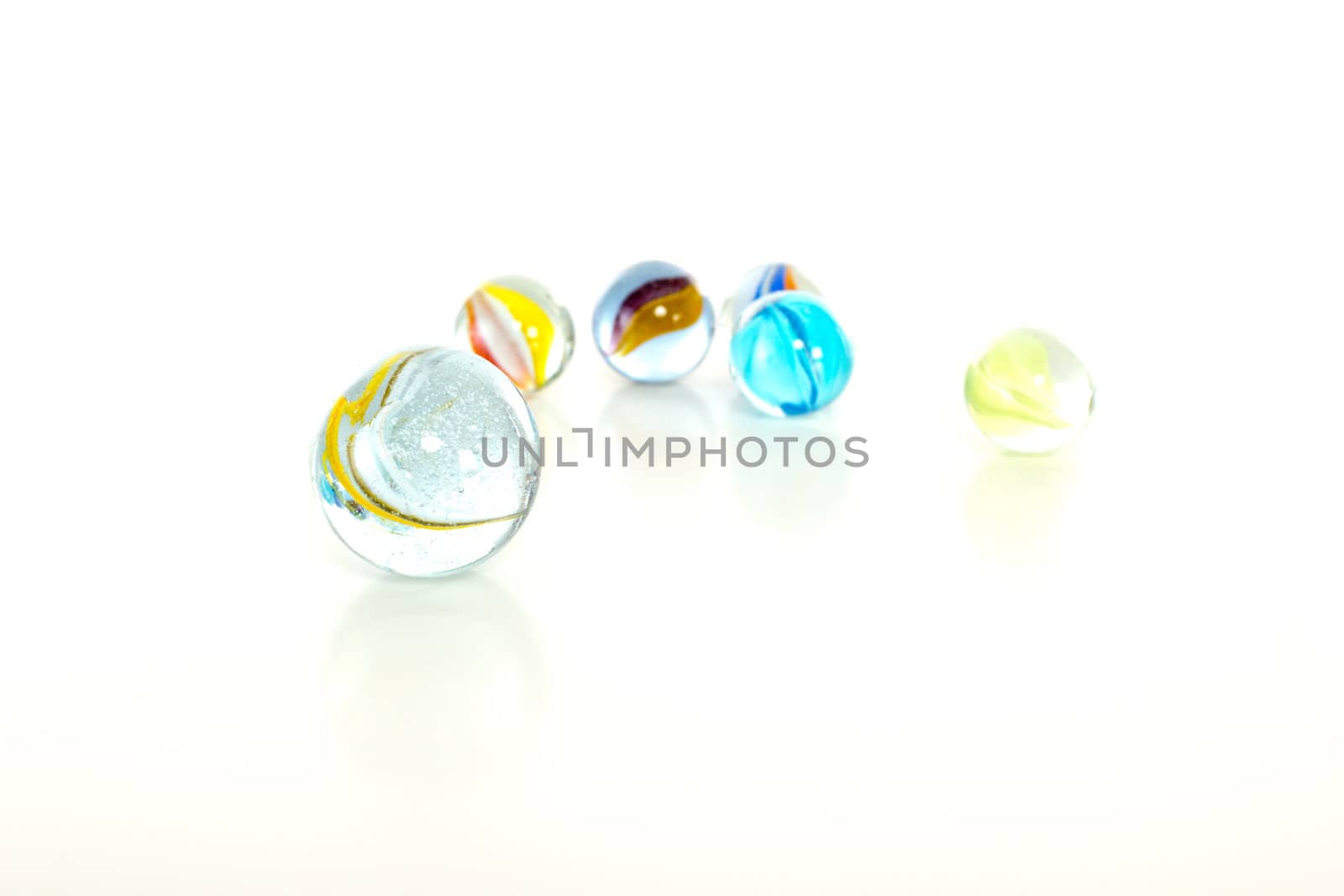 Colourful marbles on white background