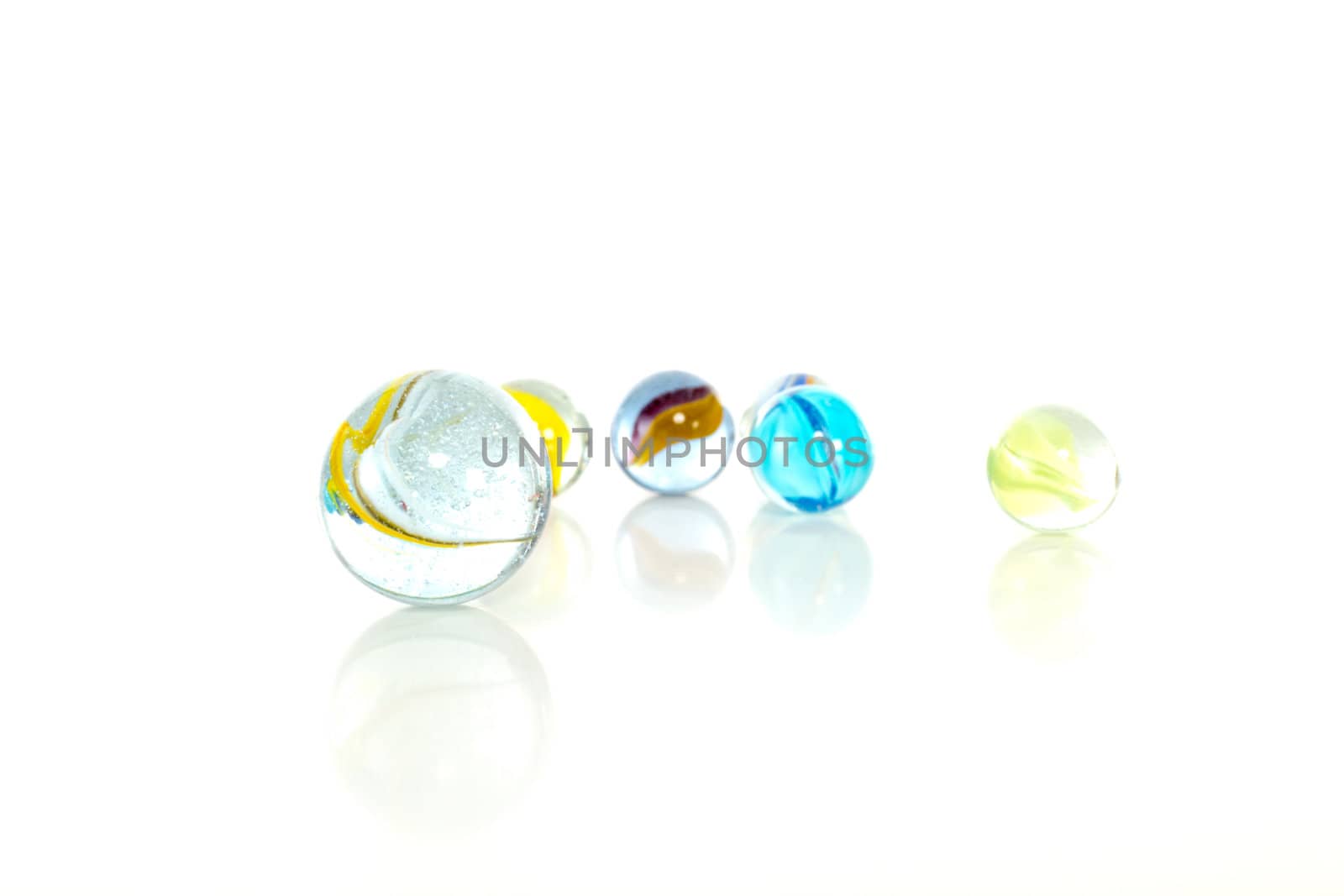 Colourful marbles on white background