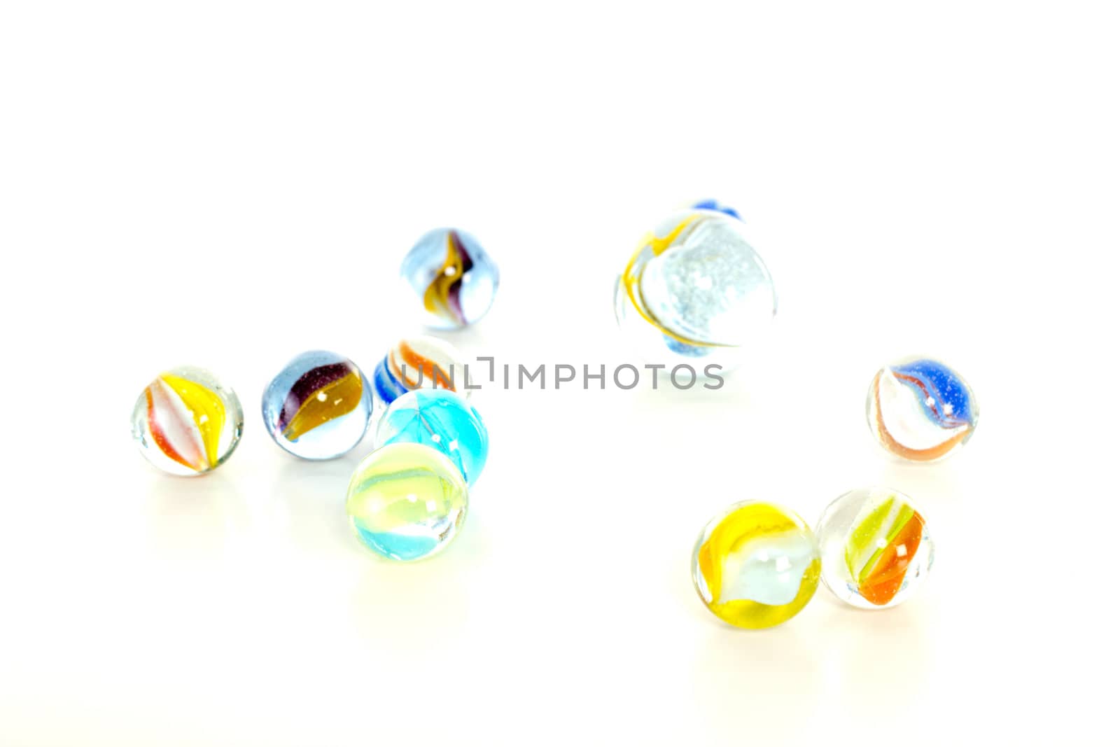 Colourful marbles on white background